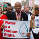 Rep. John Conyers Jr. (D-Mich.) joins demonstrators protesting the actions of the Detroit Water and Sewerage Department in Detroit on July 18, 2014.
Joshua Lott/Getty Images